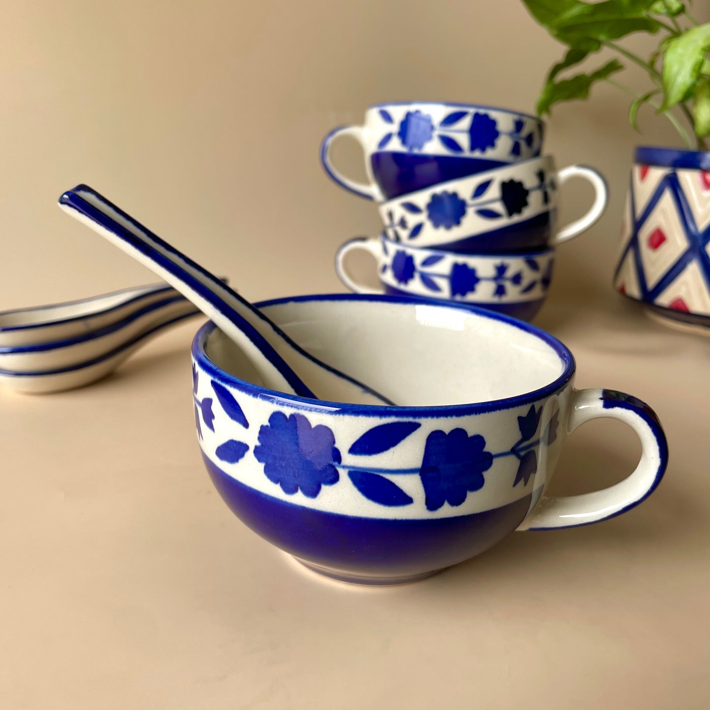 Blue floral soup cup with spoon
